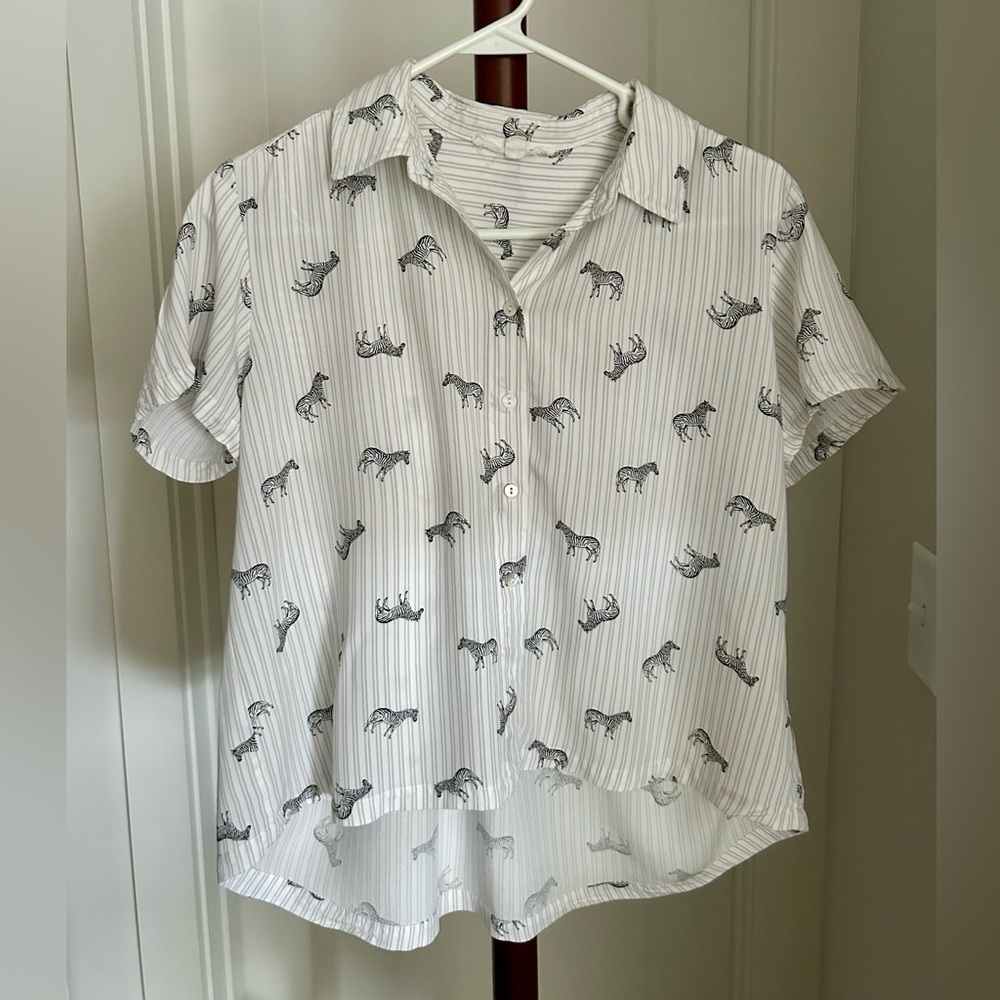 Small cropped subtle high-low striped and zebra print short sleeved blouse.